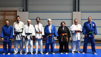 Ralf, Jörg und Laura mit ihrer Judogruppe